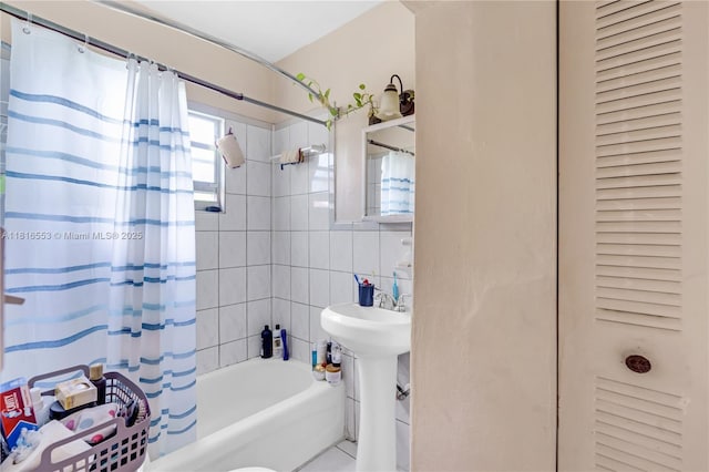 1478 SW 2nd St, Miami, FL 33135 - bathroom with shower / tub combo, a closet, a sink, and tile walls