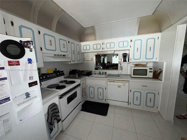3581 Inverrary Dr Unit 410, Lauderhill, FL 33319 - kitchen featuring white appliances, under cabinet range hood, light countertops, and light tile patterned floors