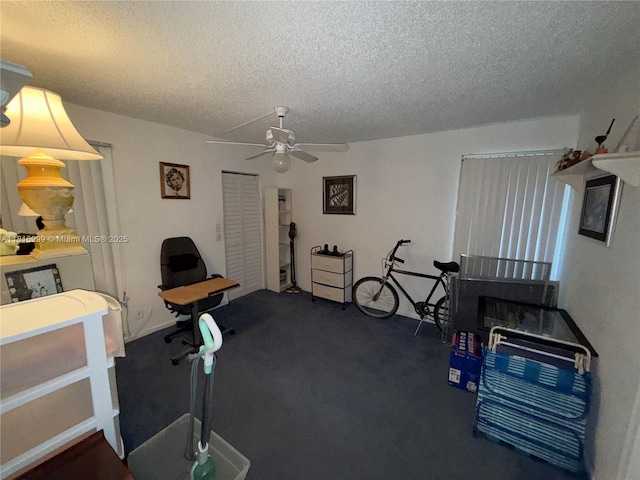 3581 Inverrary Dr Unit 410, Lauderhill, FL 33319 - exercise area featuring a textured ceiling, a ceiling fan, and dark carpet