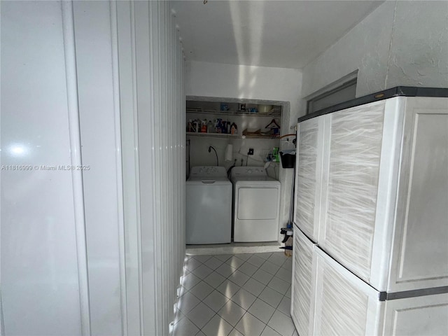 3581 Inverrary Dr Unit 410, Lauderhill, FL 33319 - washroom featuring washer and clothes dryer and tile patterned floors