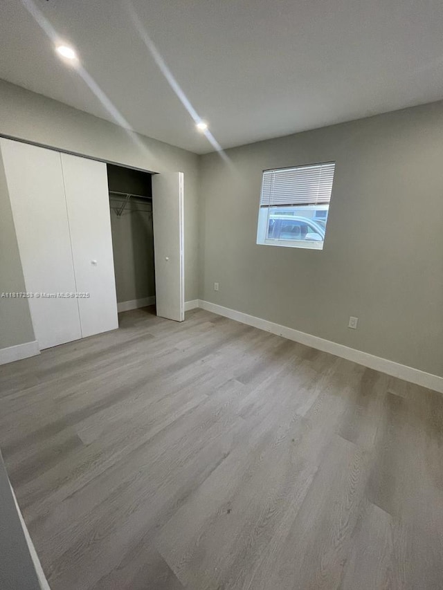 3731 SW 58th Ter, Davie, FL 33314 - unfurnished bedroom with light wood finished floors, baseboards, and a closet
