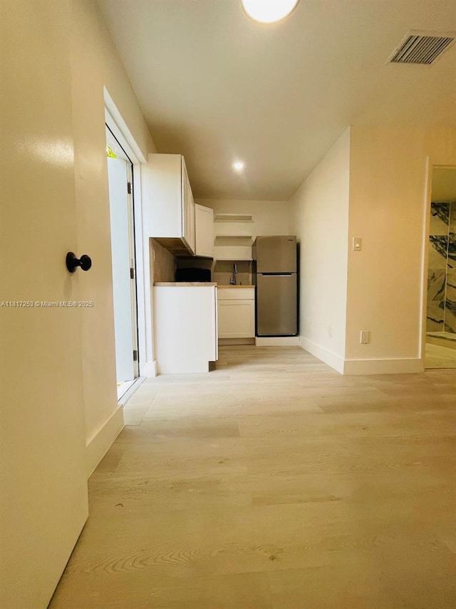 3731 SW 58th Ter, Davie, FL 33314 - corridor featuring light wood-style floors and recessed lighting