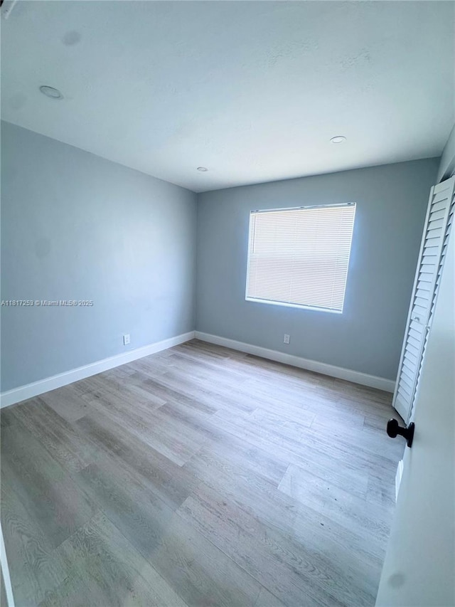3731 SW 58th Ter, Davie, FL 33314 - empty room featuring wood finished floors and baseboards