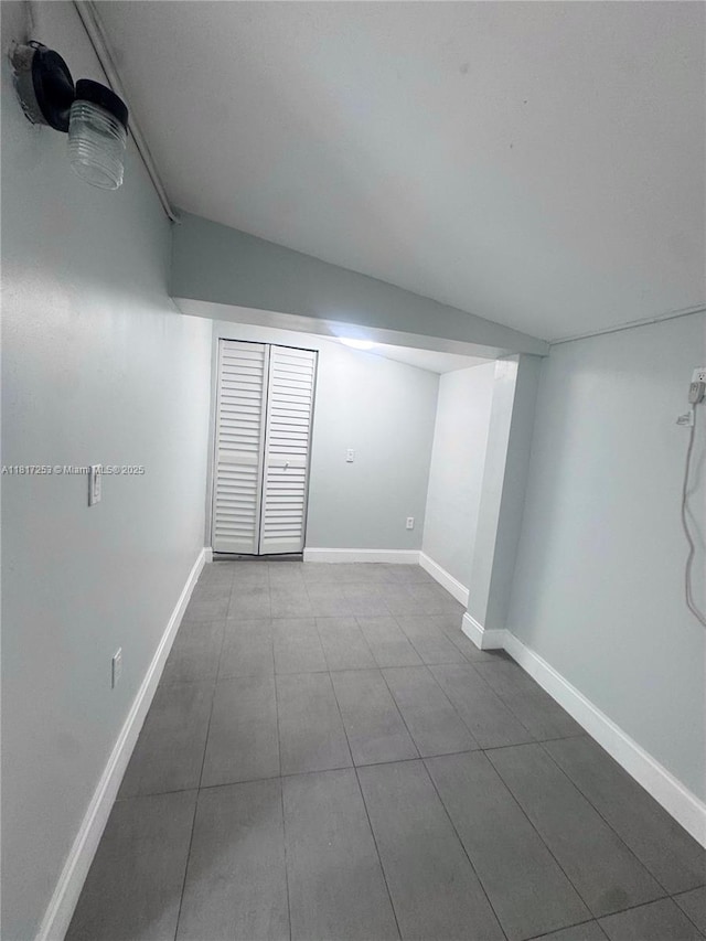 3731 SW 58th Ter, Davie, FL 33314 - spare room featuring dark tile patterned floors and baseboards