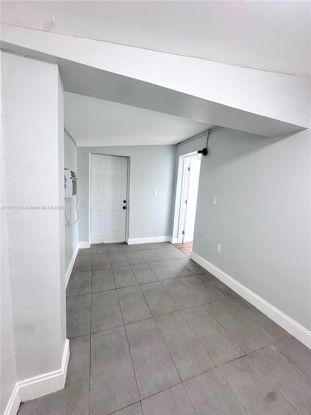 3731 SW 58th Ter, Davie, FL 33314 - tiled spare room with baseboards and an AC wall unit