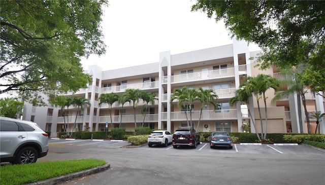 2601 N Nob Hill Rd Unit 405, Sunrise, FL 33322 - view of apartment building / complex featuring uncovered parking