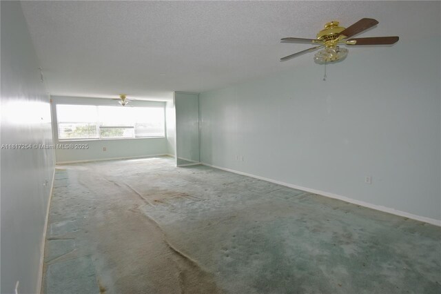 2601 N Nob Hill Rd Unit 405, Sunrise, FL 33322 - carpeted empty room with baseboards, a ceiling fan, and a textured ceiling