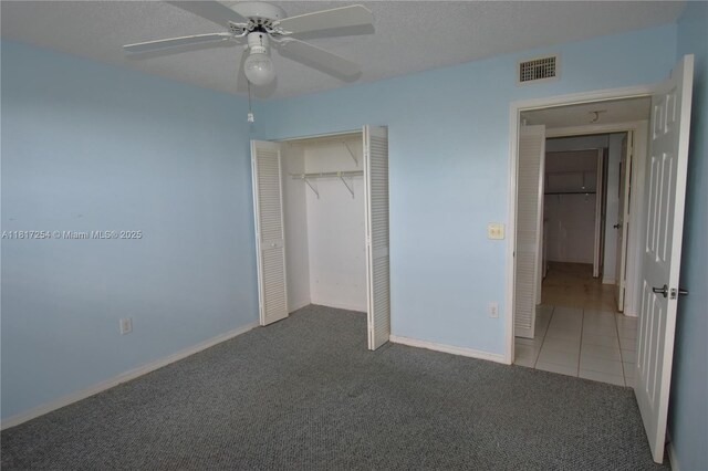 2601 N Nob Hill Rd Unit 405, Sunrise, FL 33322 - unfurnished bedroom with carpet flooring, a closet, ceiling fan, baseboards, and tile patterned flooring
