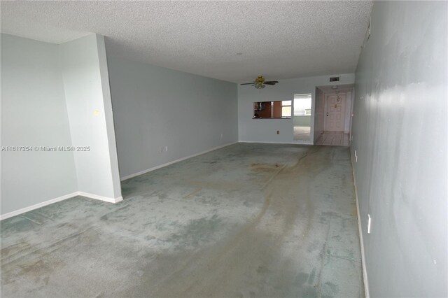 2601 N Nob Hill Rd Unit 405, Sunrise, FL 33322 - unfurnished room featuring ceiling fan, carpet flooring, a textured ceiling, and baseboards