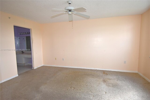 2601 N Nob Hill Rd Unit 405, Sunrise, FL 33322 - spare room featuring ceiling fan, carpet flooring, baseboards, and a textured ceiling