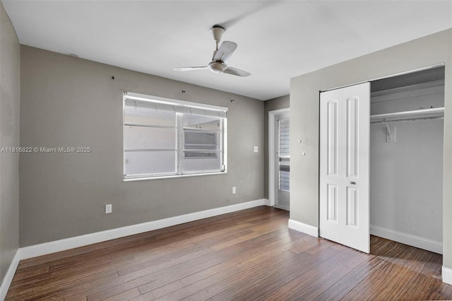 27 Robalo Ct, North Palm Beach, FL 33408 - unfurnished bedroom with hardwood / wood-style flooring, baseboards, a closet, and a ceiling fan