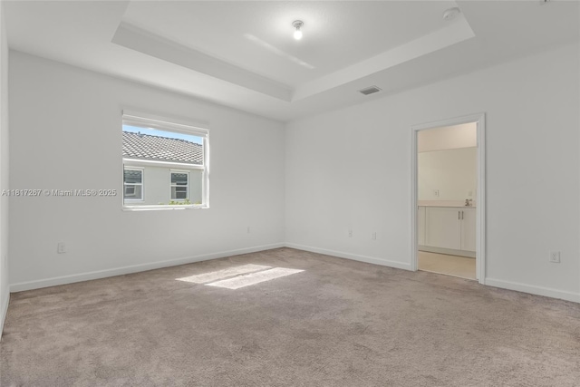 2608 SE 11th Ct Unit 2608, Homestead, FL 33035 - empty room with a raised ceiling, carpet floors, baseboards, and a smoke detector