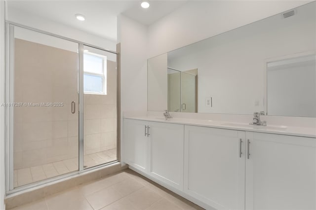 2608 SE 11th Ct Unit 2608, Homestead, FL 33035 - bathroom with double vanity, a stall shower, tile patterned flooring, and recessed lighting