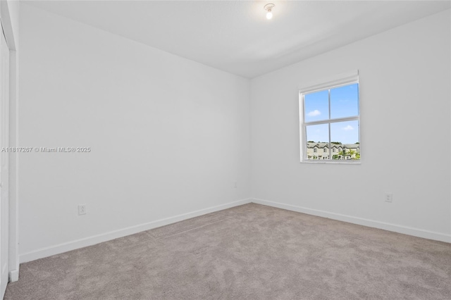 2608 SE 11th Ct Unit 2608, Homestead, FL 33035 - carpeted spare room featuring baseboards