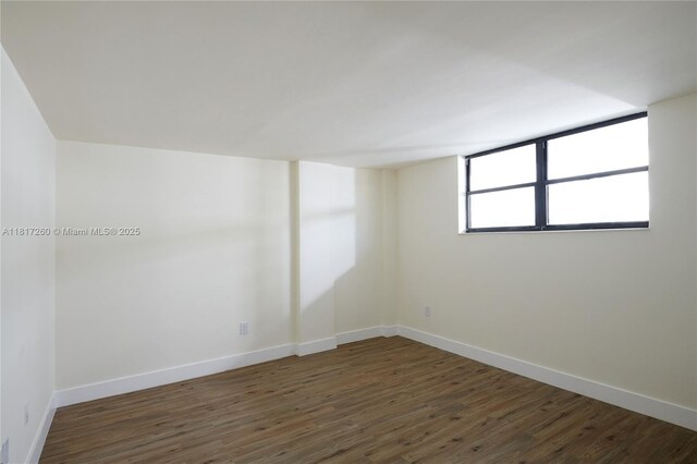 5845 Collins Ave Unit 304, Miami Beach, FL 33140 - spare room with baseboards and wood finished floors