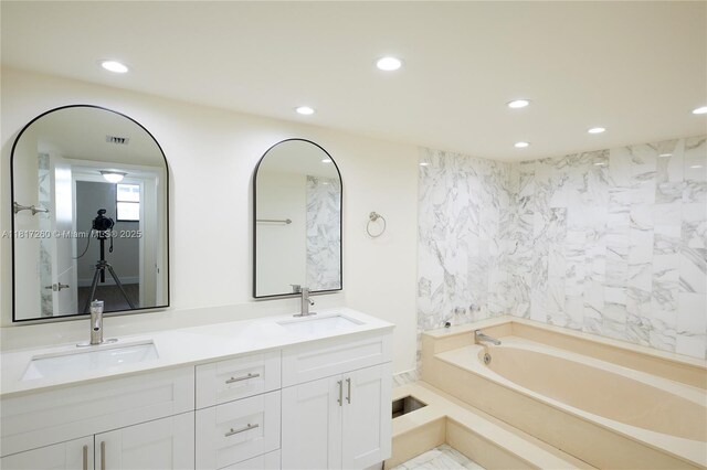 5845 Collins Ave Unit 304, Miami Beach, FL 33140 - full bathroom with recessed lighting, a bath, and double vanity