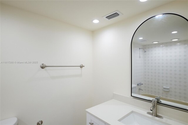 5845 Collins Ave Unit 304, Miami Beach, FL 33140 - bathroom with vanity, toilet, recessed lighting, and shower / washtub combination