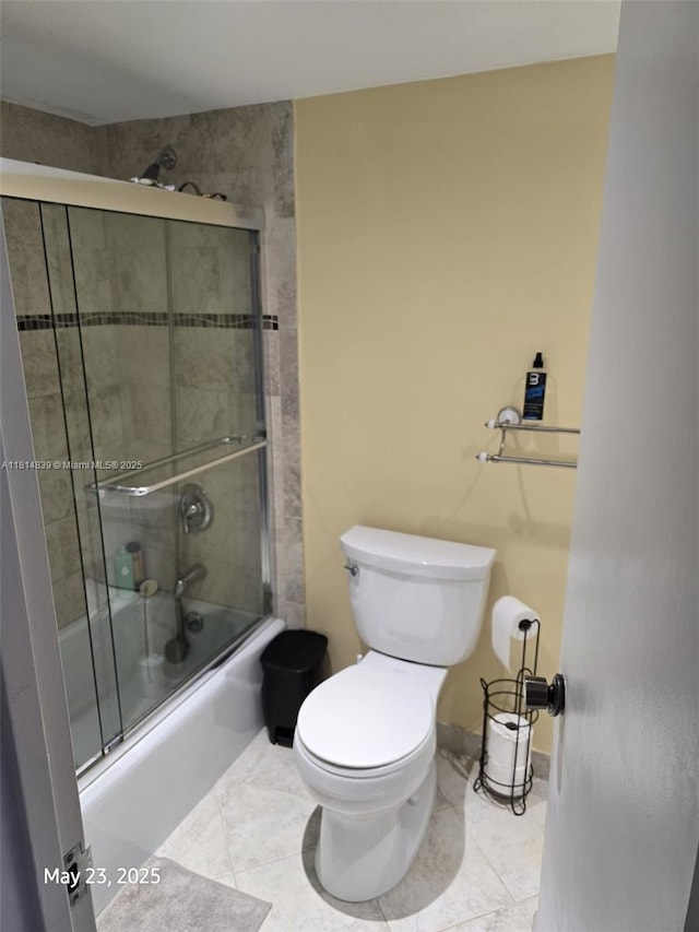 230 174th St Unit 1805, Sunny Isles Beach, FL 33160 - bathroom with toilet, enclosed tub / shower combo, and tile patterned floors