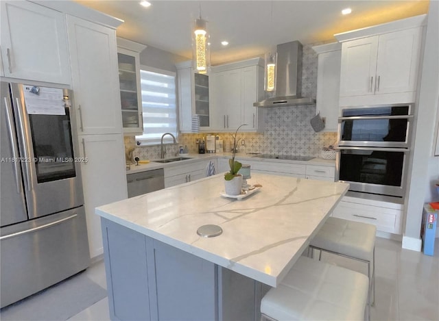 14121 SW 152nd Ter, Miami, FL 33177 - kitchen with stainless steel appliances, wall chimney exhaust hood, tasteful backsplash, glass insert cabinets, and light stone counters