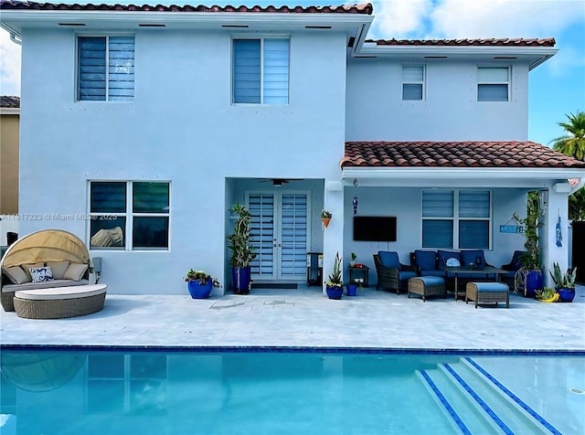14121 SW 152nd Ter, Miami, FL 33177 - back of house featuring a patio, a tiled roof, stucco siding, and outdoor lounge area