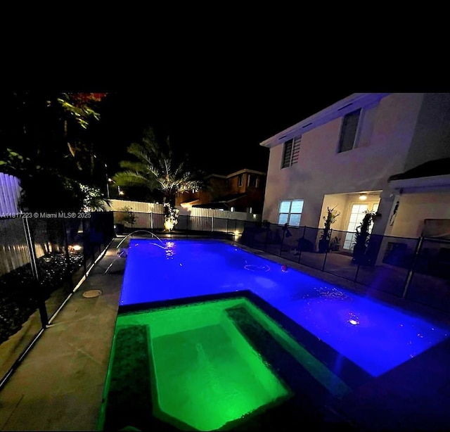 14121 SW 152nd Ter, Miami, FL 33177 - pool at twilight featuring a fenced backyard