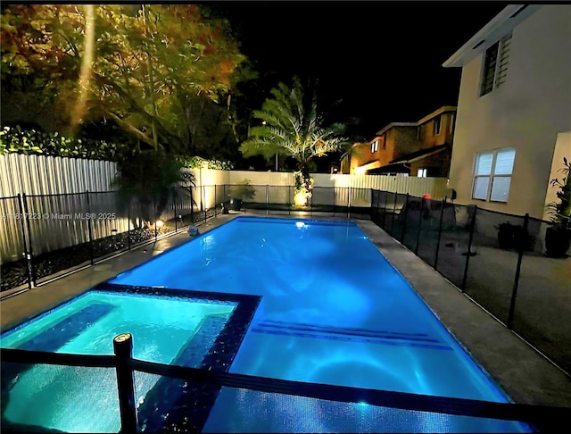 14121 SW 152nd Ter, Miami, FL 33177 - pool at twilight with a fenced backyard and a pool with connected hot tub