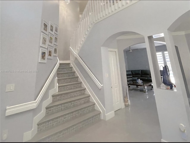 14121 SW 152nd Ter, Miami, FL 33177 - stairway featuring arched walkways, concrete flooring, and a high ceiling
