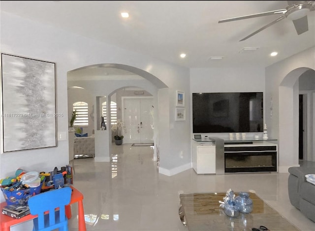 14121 SW 152nd Ter, Miami, FL 33177 - living area with arched walkways, ceiling fan, tile patterned flooring, and recessed lighting