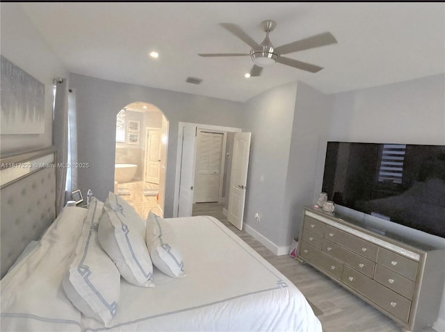 14121 SW 152nd Ter, Miami, FL 33177 - bedroom featuring arched walkways, light wood-style floors, recessed lighting, ensuite bath, and a ceiling fan