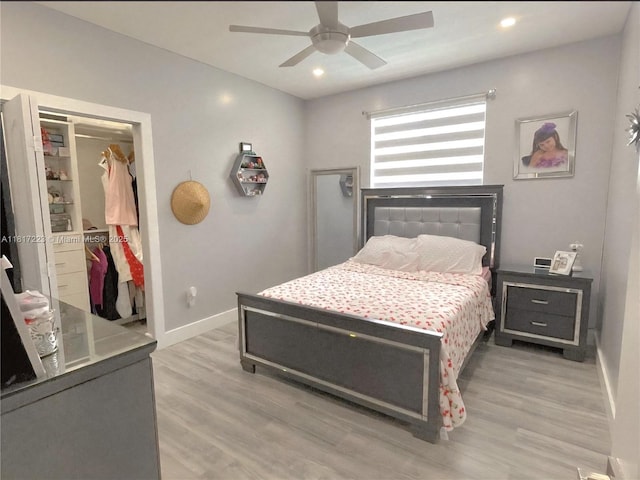 14121 SW 152nd Ter, Miami, FL 33177 - bedroom with light wood-type flooring, a spacious closet, ceiling fan, a closet, and recessed lighting