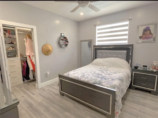14121 SW 152nd Ter, Miami, FL 33177 - bedroom featuring a walk in closet, light wood-style flooring, a closet, and ceiling fan