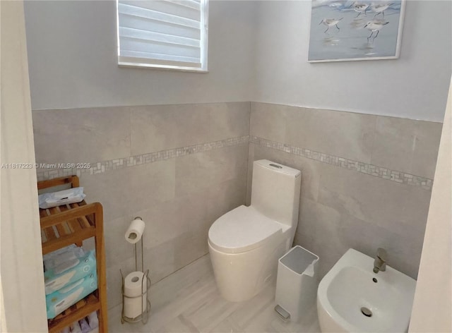 14121 SW 152nd Ter, Miami, FL 33177 - half bathroom with tile walls and a bidet