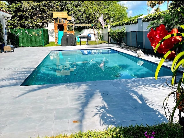 14121 SW 152nd Ter, Miami, FL 33177 - view of swimming pool with a fenced backyard and a patio