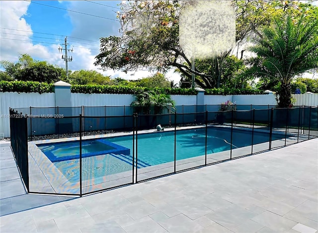 14121 SW 152nd Ter, Miami, FL 33177 - view of swimming pool with a pool with connected hot tub and a patio area