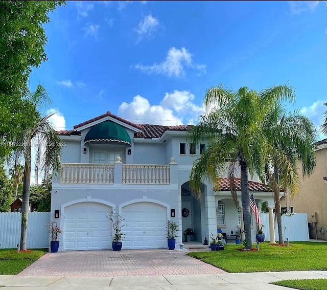 14121 SW 152nd Ter, Miami, FL 33177 - mediterranean / spanish home featuring a tiled roof, a balcony, decorative driveway, and stucco siding