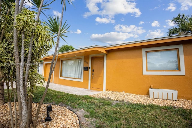 6541 NW 24th St, Sunrise, FL 33313 - view of exterior entry featuring stucco siding