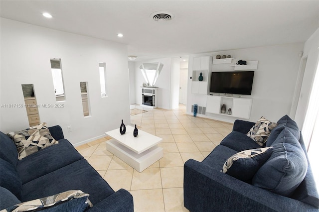 6541 NW 24th St, Sunrise, FL 33313 - living area featuring light tile patterned floors, recessed lighting, and baseboards