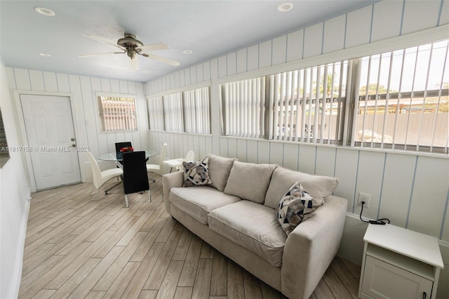 6541 NW 24th St, Sunrise, FL 33313 - living room with light wood-style floors, a ceiling fan, and a desk