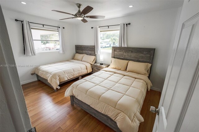 6541 NW 24th St, Sunrise, FL 33313 - bedroom featuring wood finished floors, recessed lighting, ceiling fan, and baseboards