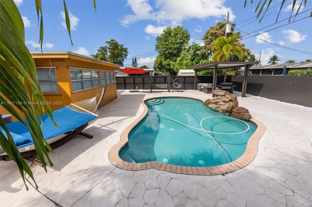 6541 NW 24th St, Sunrise, FL 33313 - view of swimming pool featuring a patio and a fenced backyard
