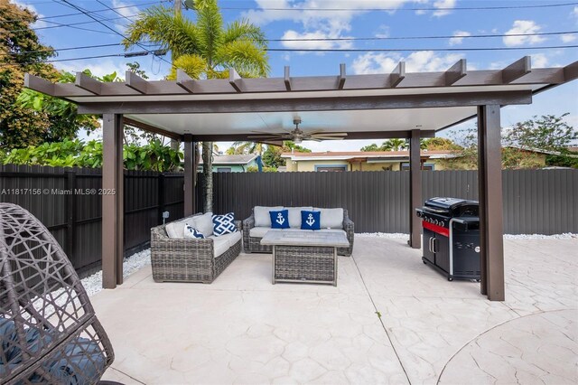 6541 NW 24th St, Sunrise, FL 33313 - fenced backyard featuring a patio area, an outdoor living space, a ceiling fan, and a grill