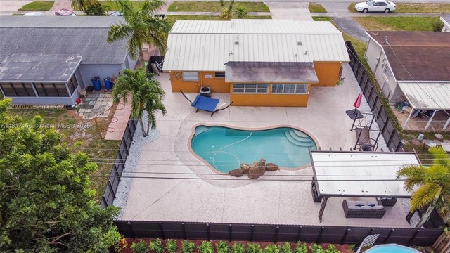6541 NW 24th St, Sunrise, FL 33313 - view of pool featuring a patio and a fenced backyard