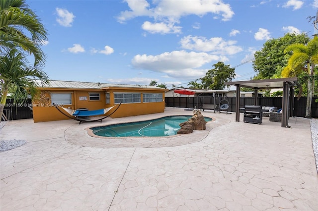 6541 NW 24th St, Sunrise, FL 33313 - view of pool featuring a patio and a fenced backyard