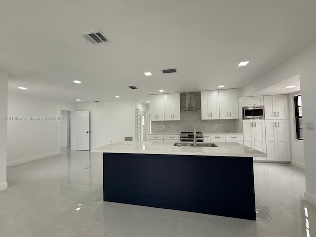 4314 SW 97th Ct, Miami, FL 33165 - kitchen featuring wall chimney range hood, stainless steel microwave, white cabinets, baseboards, and recessed lighting