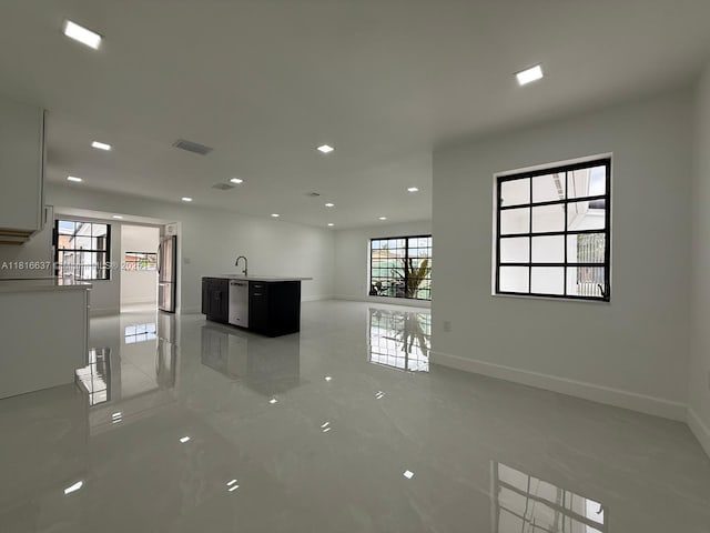 4314 SW 97th Ct, Miami, FL 33165 - empty room featuring baseboards, a sink, recessed lighting, and light marble finish floors