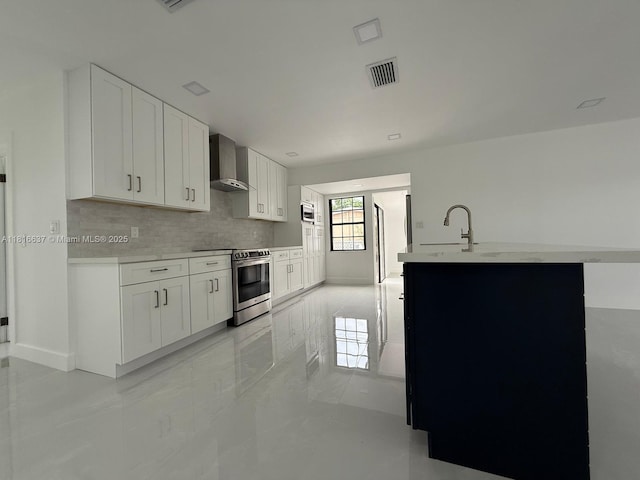 4314 SW 97th Ct, Miami, FL 33165 - kitchen with appliances with stainless steel finishes, wall chimney exhaust hood, decorative backsplash, white cabinets, and a sink