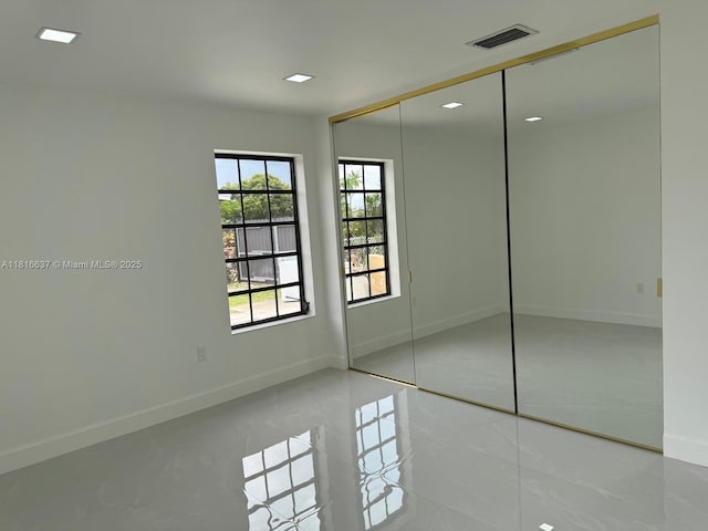 4314 SW 97th Ct, Miami, FL 33165 - unfurnished bedroom featuring baseboards, tile patterned floors, a closet, and recessed lighting