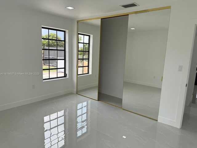 4314 SW 97th Ct, Miami, FL 33165 - unfurnished bedroom featuring baseboards, light tile patterned floors, and a closet