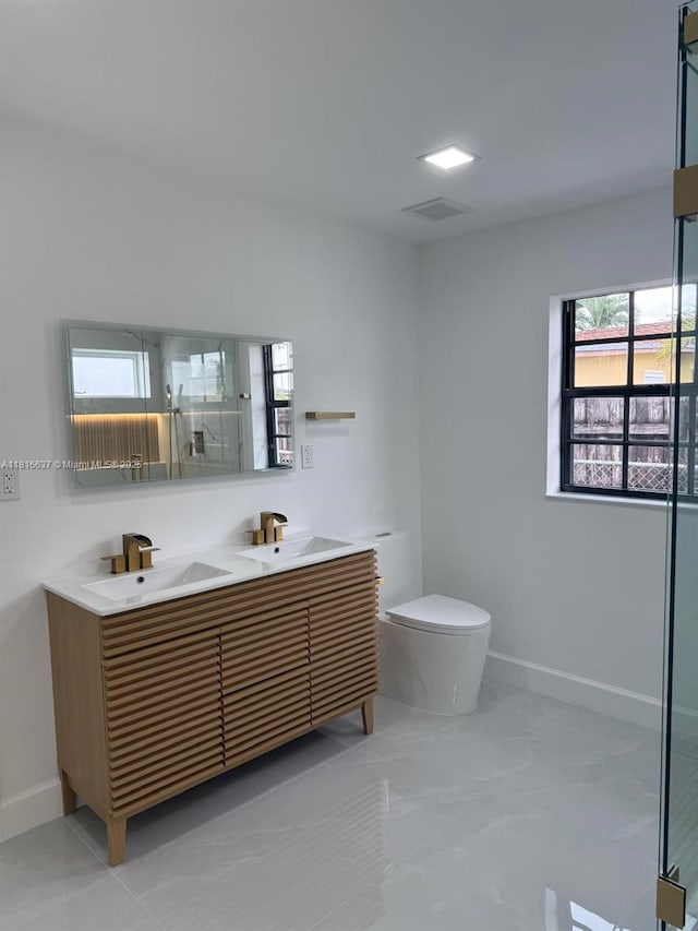 4314 SW 97th Ct, Miami, FL 33165 - full bath featuring double vanity, toilet, baseboards, and a shower with door