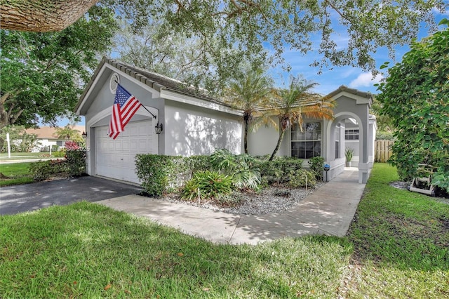 9012 Lake Park Cir S, Davie, FL 33328 - ranch-style home with stucco siding, a front lawn, driveway, and an attached garage